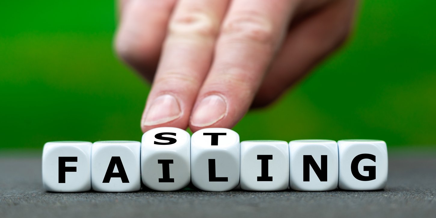 Hand turns dice and changes the expression "failing" to Fasting".